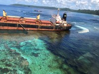 Image of MV Solomon Trader grounded on a reef on the western side of Rennel Island 