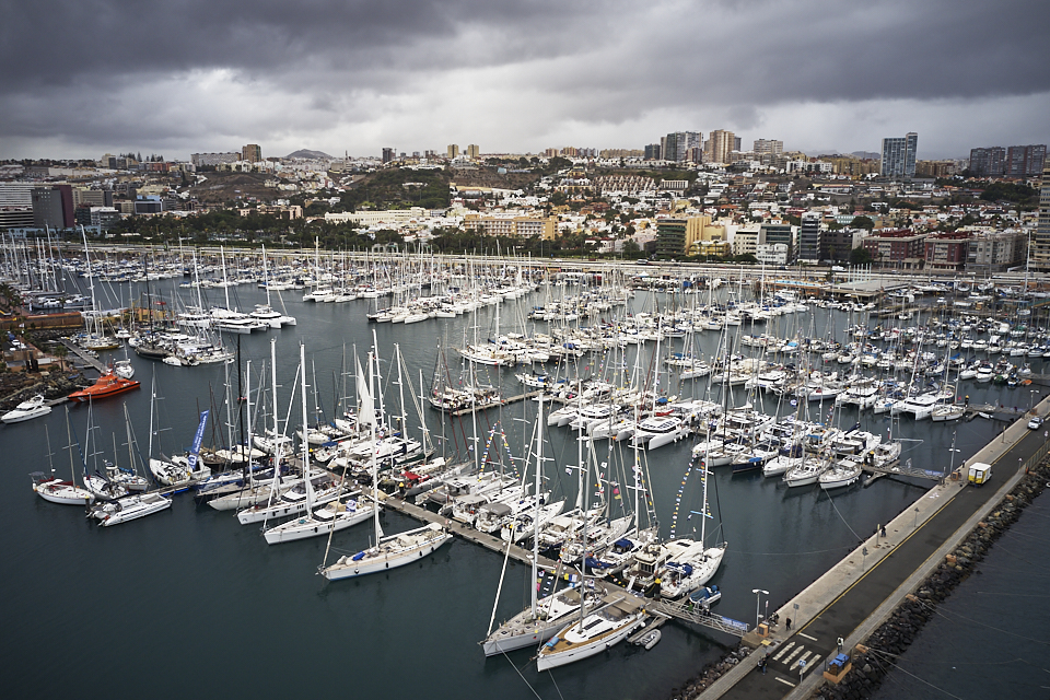 aerial view of a marina with long pontoons and all sizes of yachts moored