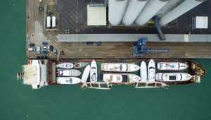 An aerial view of a freighter loaded up with yachts ready for transport