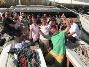 Group of sailors having a good time on board one of the rally boats