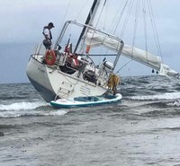 yacht shipwrecked on a reef