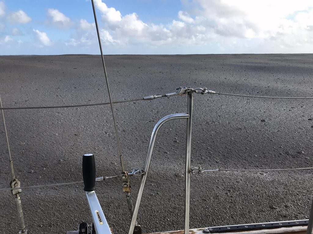 The ocean covered with a grey mass of pumice