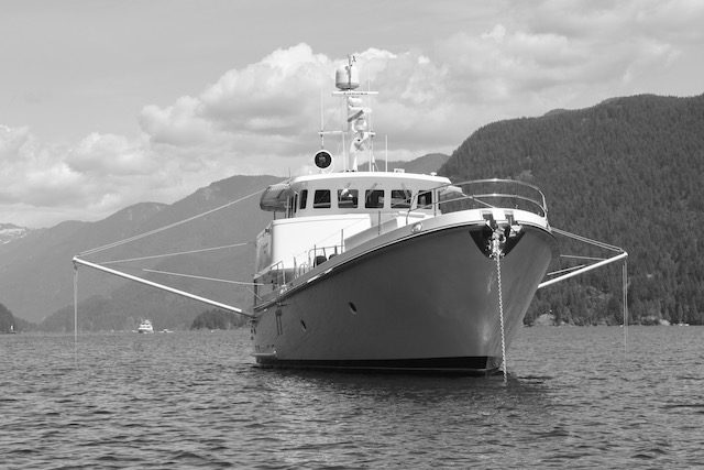 large white motor yacht anchored in a canadian sound