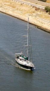 Yacht in the Suez Canal pictured from above.