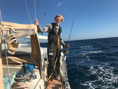 Man standing on a yacht in the ocean