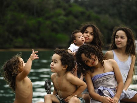 Six children in a boat on the water